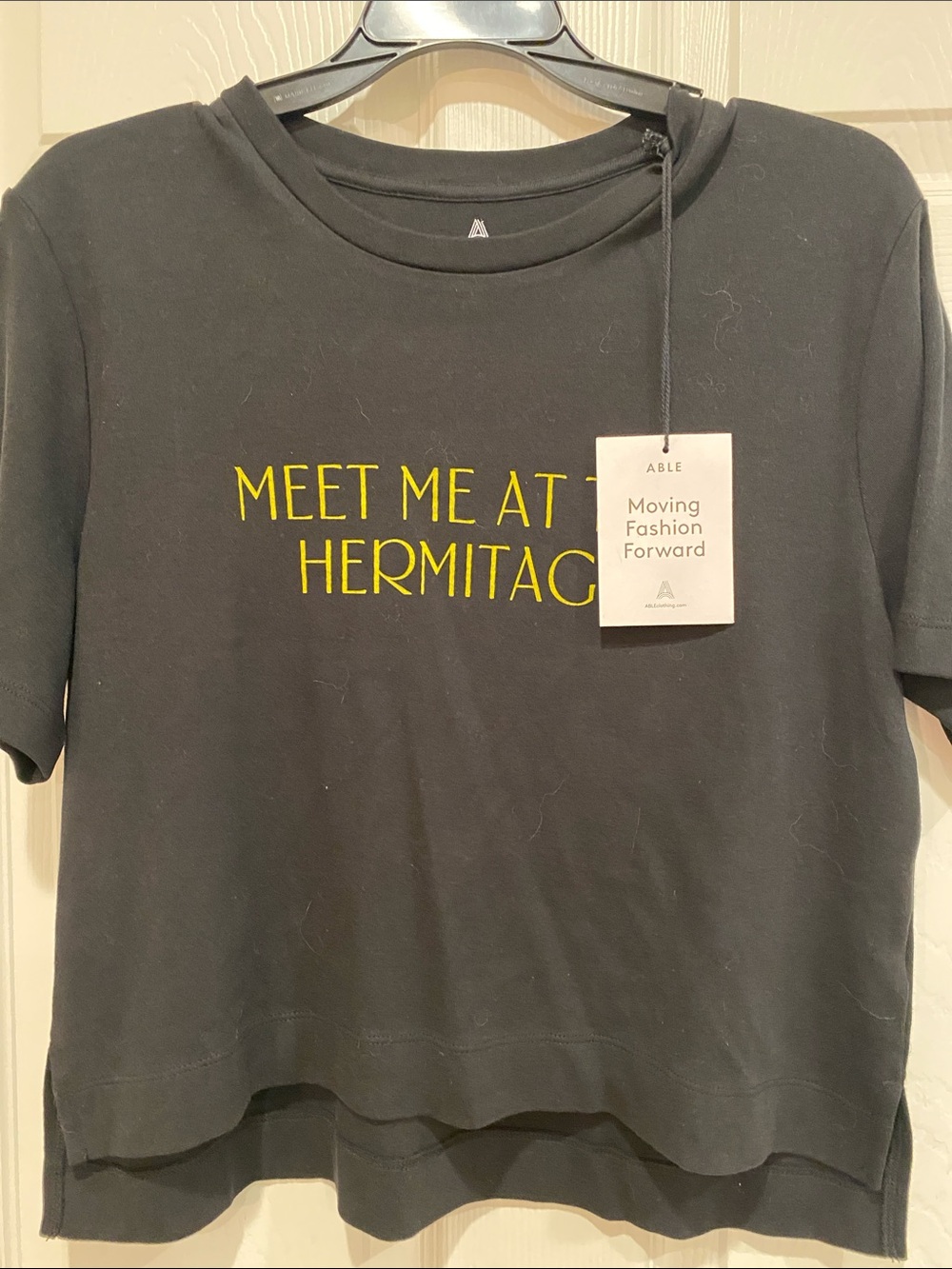 Able Black Short Sleeve Tee with Yellow 'Meet Me at the Hermitage' Print